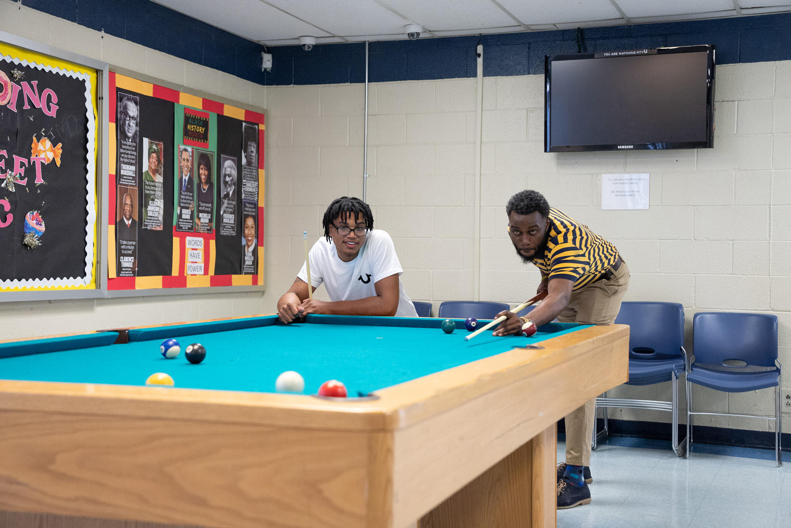 two people playing pool or billiards